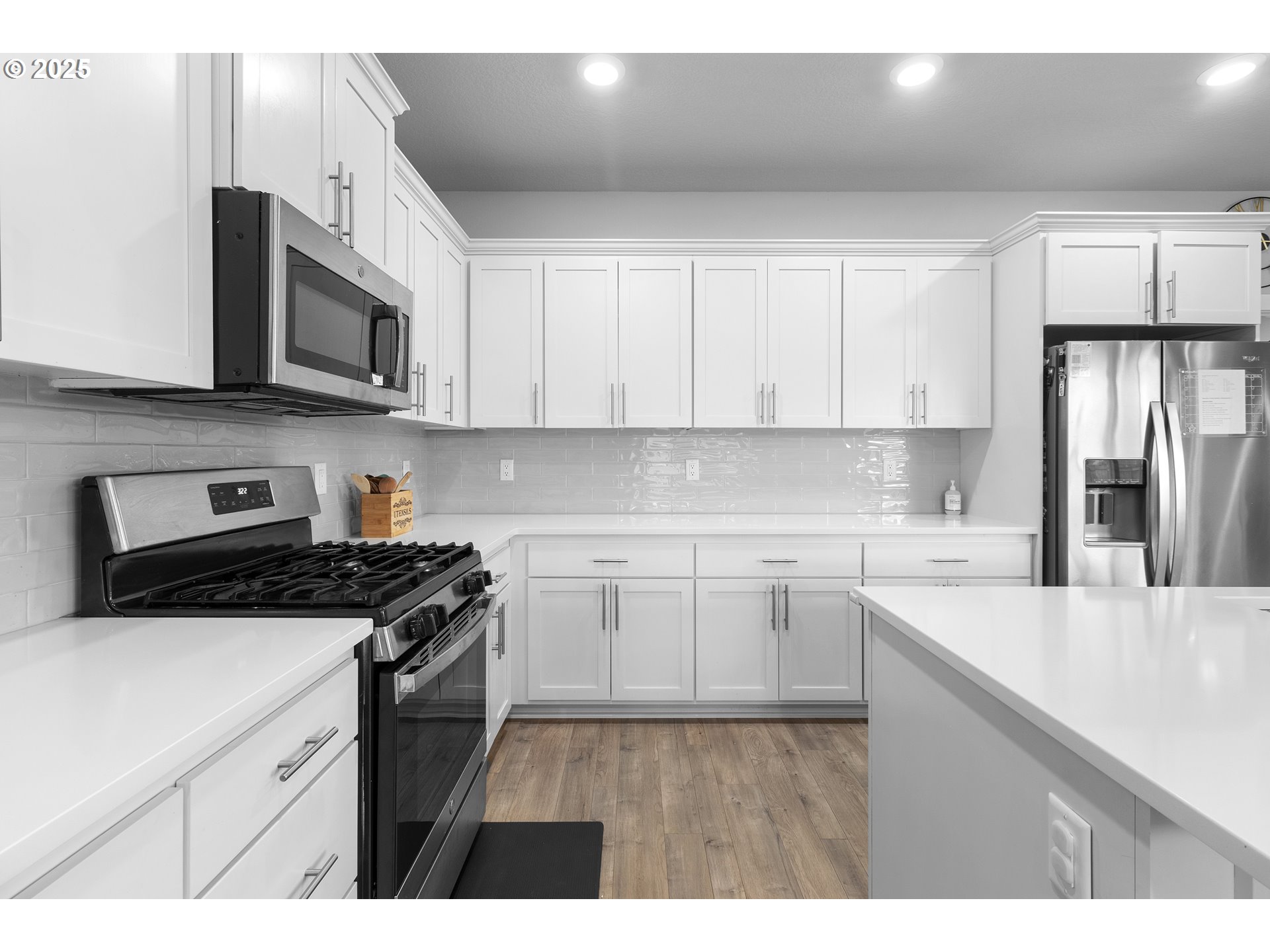 3072 Southeast 25th Street Gresham, OR 97080 - Photo 12 of 48 a kitchen with stainless steel appliances granite countertop a stove a sink dishwasher and a refrigerator