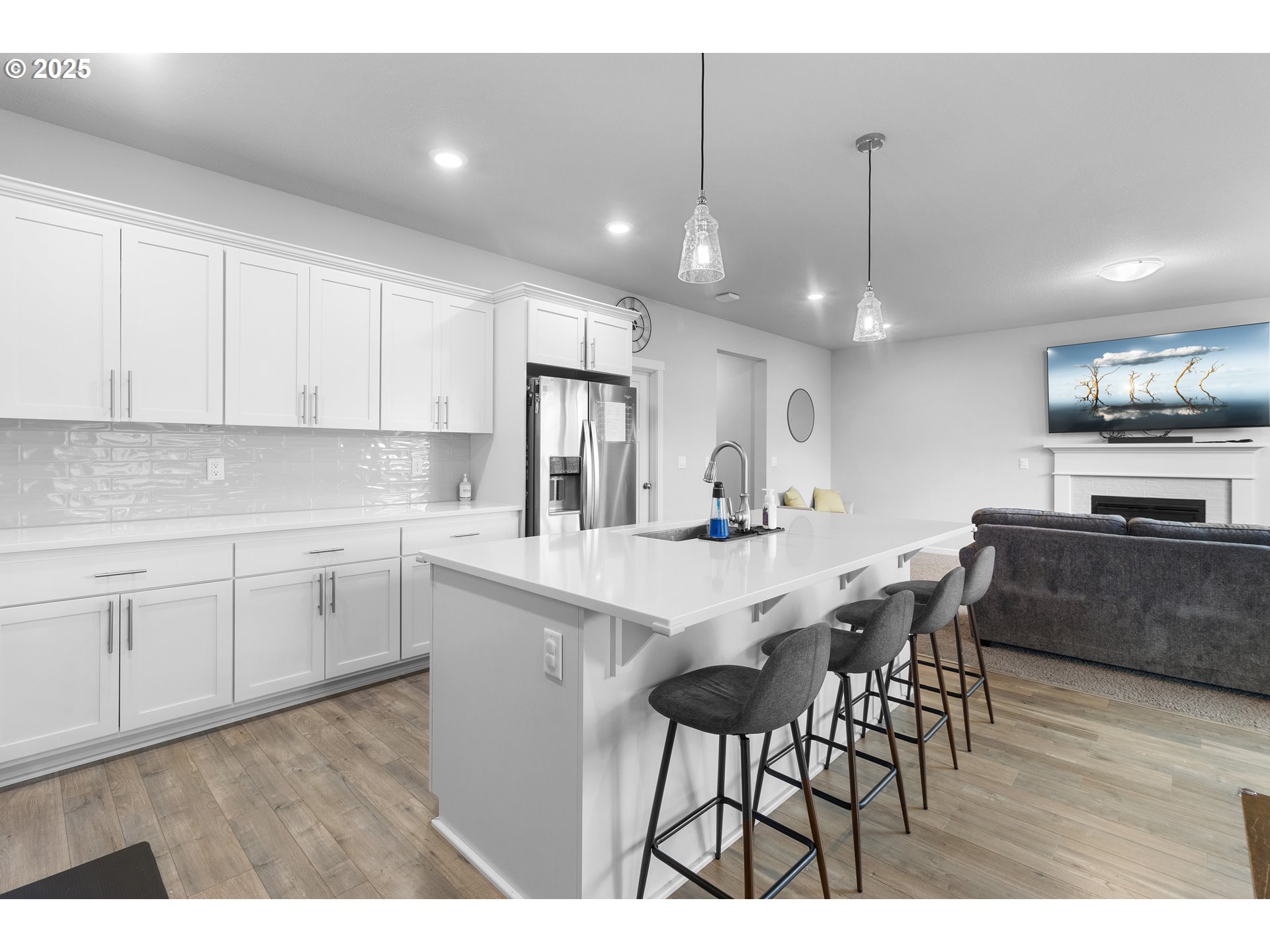 3072 Southeast 25th Street Gresham, OR 97080 - Photo 16 of 48 a kitchen with stainless steel appliances kitchen island granite countertop a sink a stove a dining table and chairs