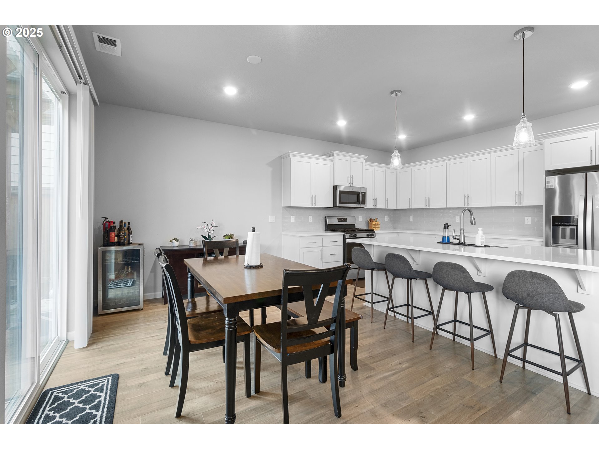 3072 Southeast 25th Street Gresham, OR 97080 - Photo 18 of 48 a view of kitchen with dining table chairs cabinets and stainless steel appliances