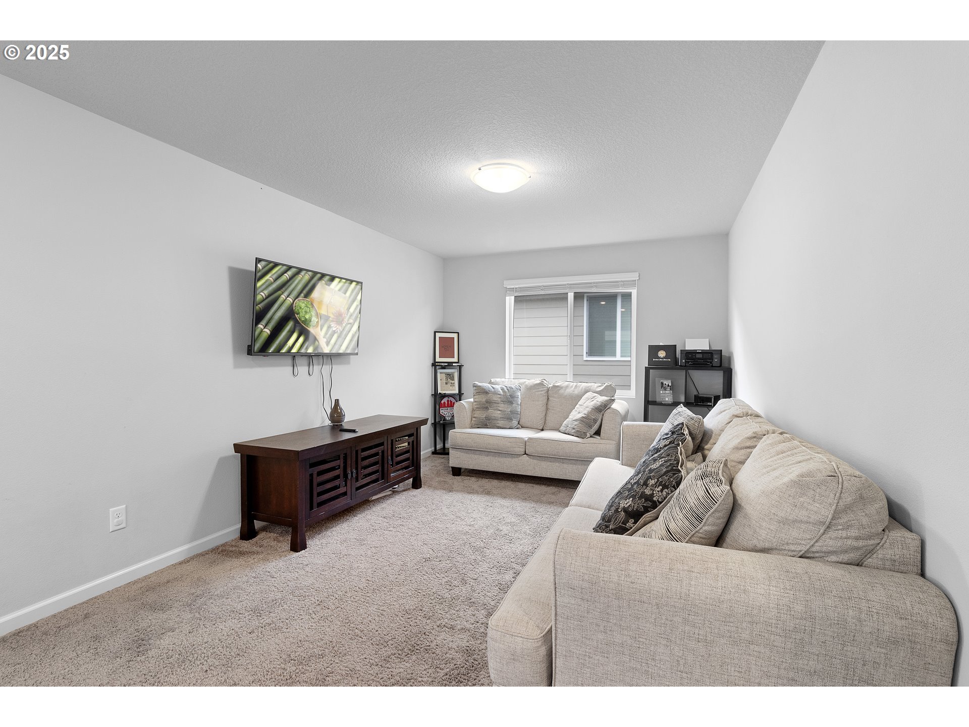 3072 Southeast 25th Street Gresham, OR 97080 - Photo 24 of 48 a living room with furniture and a flat screen tv