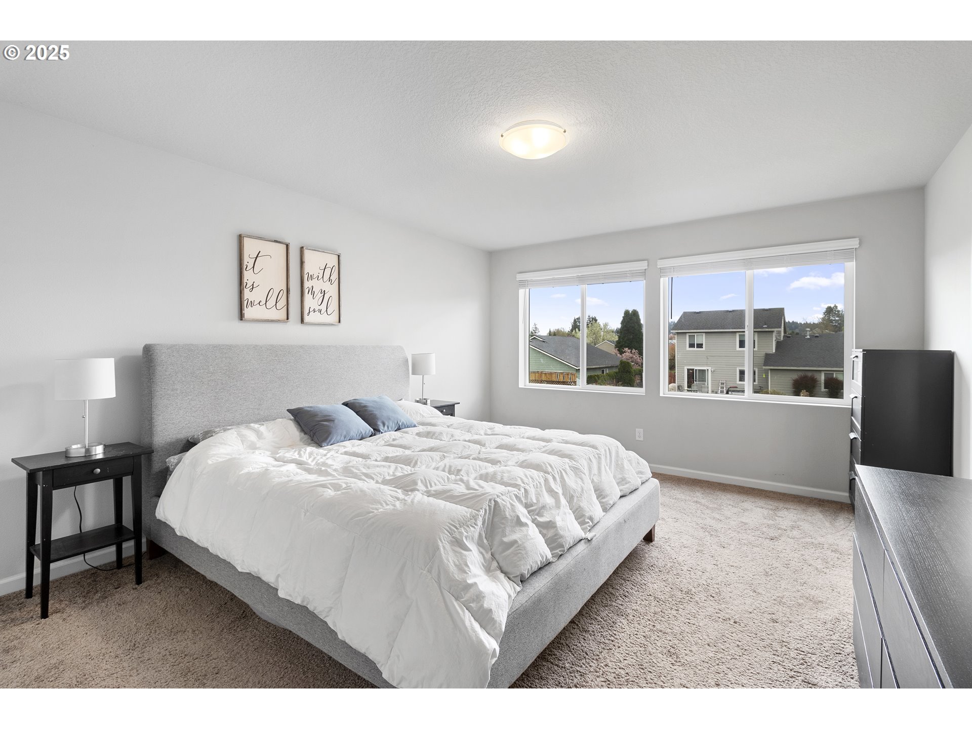 3072 Southeast 25th Street Gresham, OR 97080 - Photo 27 of 48 a bedroom with a large bed and a large window