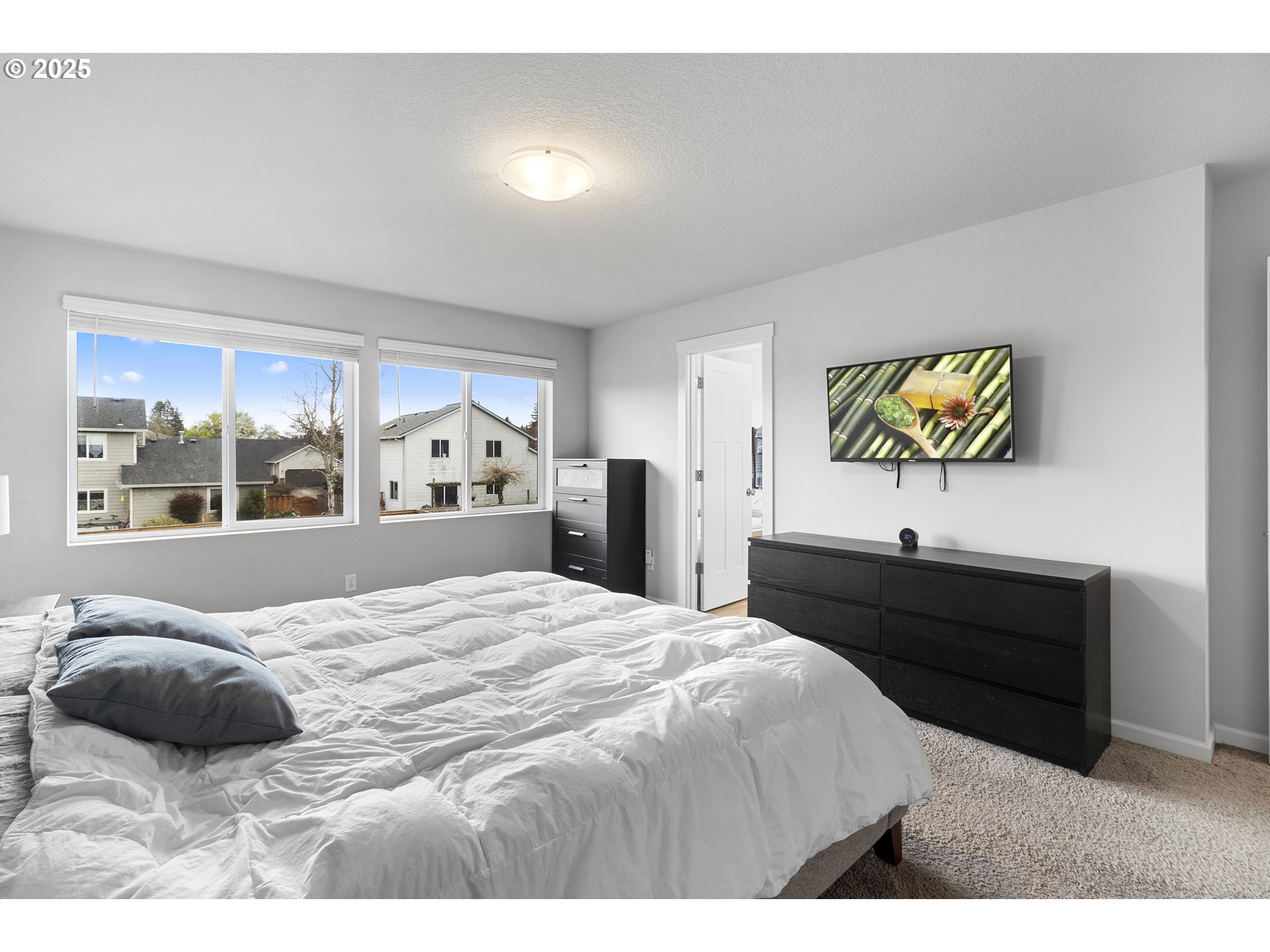 3072 Southeast 25th Street Gresham, OR 97080 - Photo 29 of 48 a bedroom with a bed and a large window