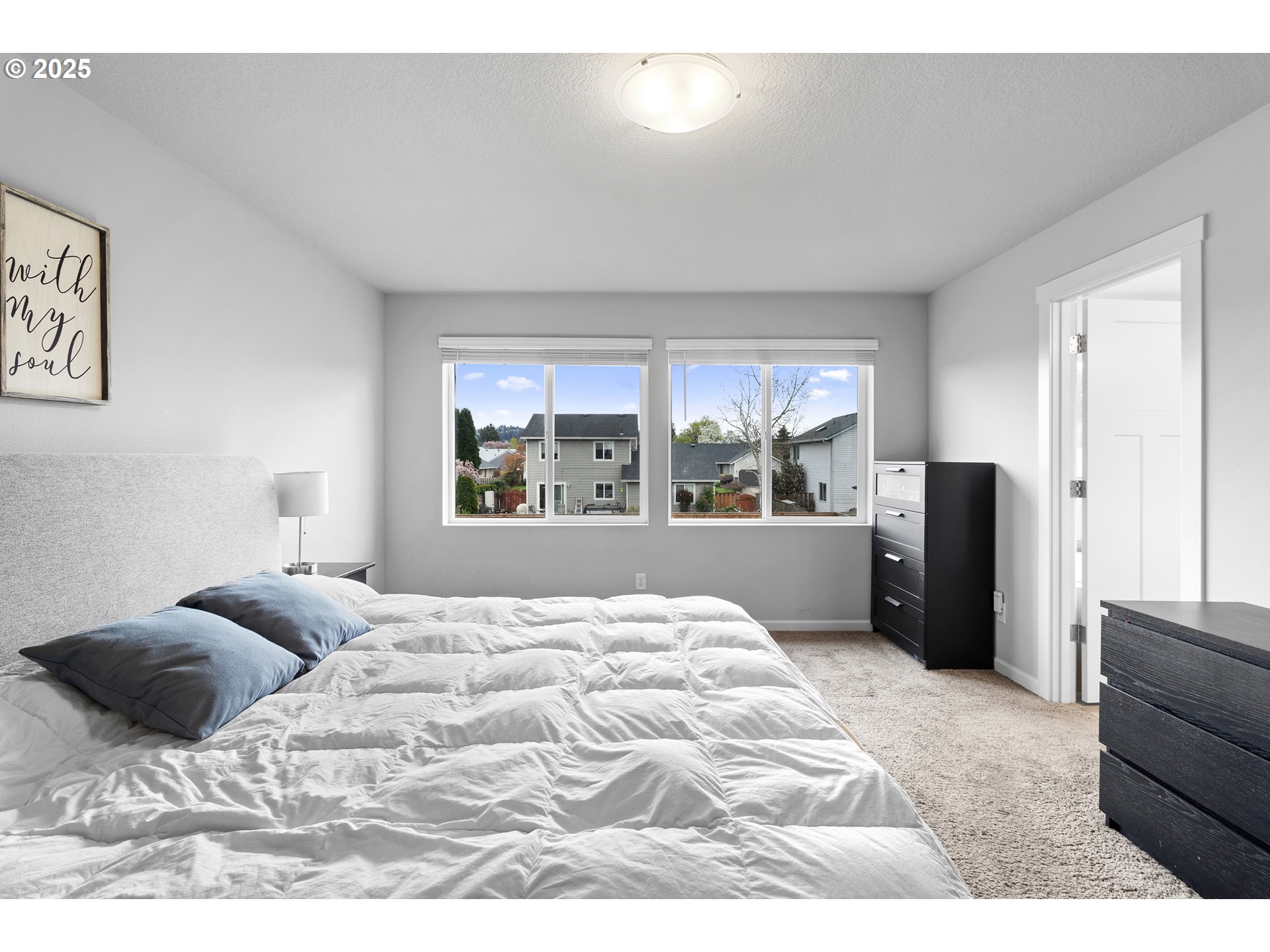 3072 Southeast 25th Street Gresham, OR 97080 - Photo 30 of 48 a bedroom with a bed and wooden floor