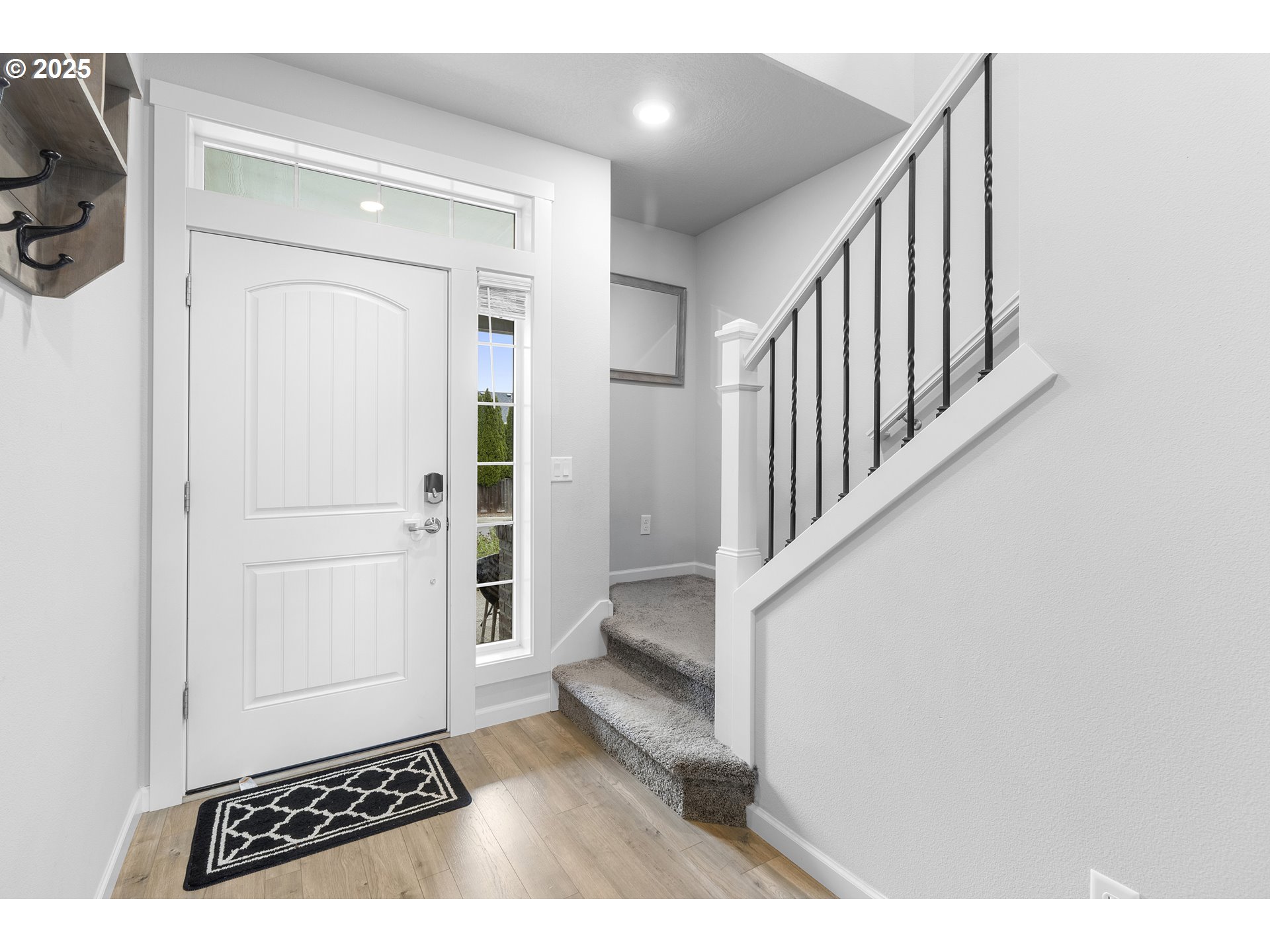 3072 Southeast 25th Street Gresham, OR 97080 - Photo 3 of 48 a view of a hallway with white walls and stairs