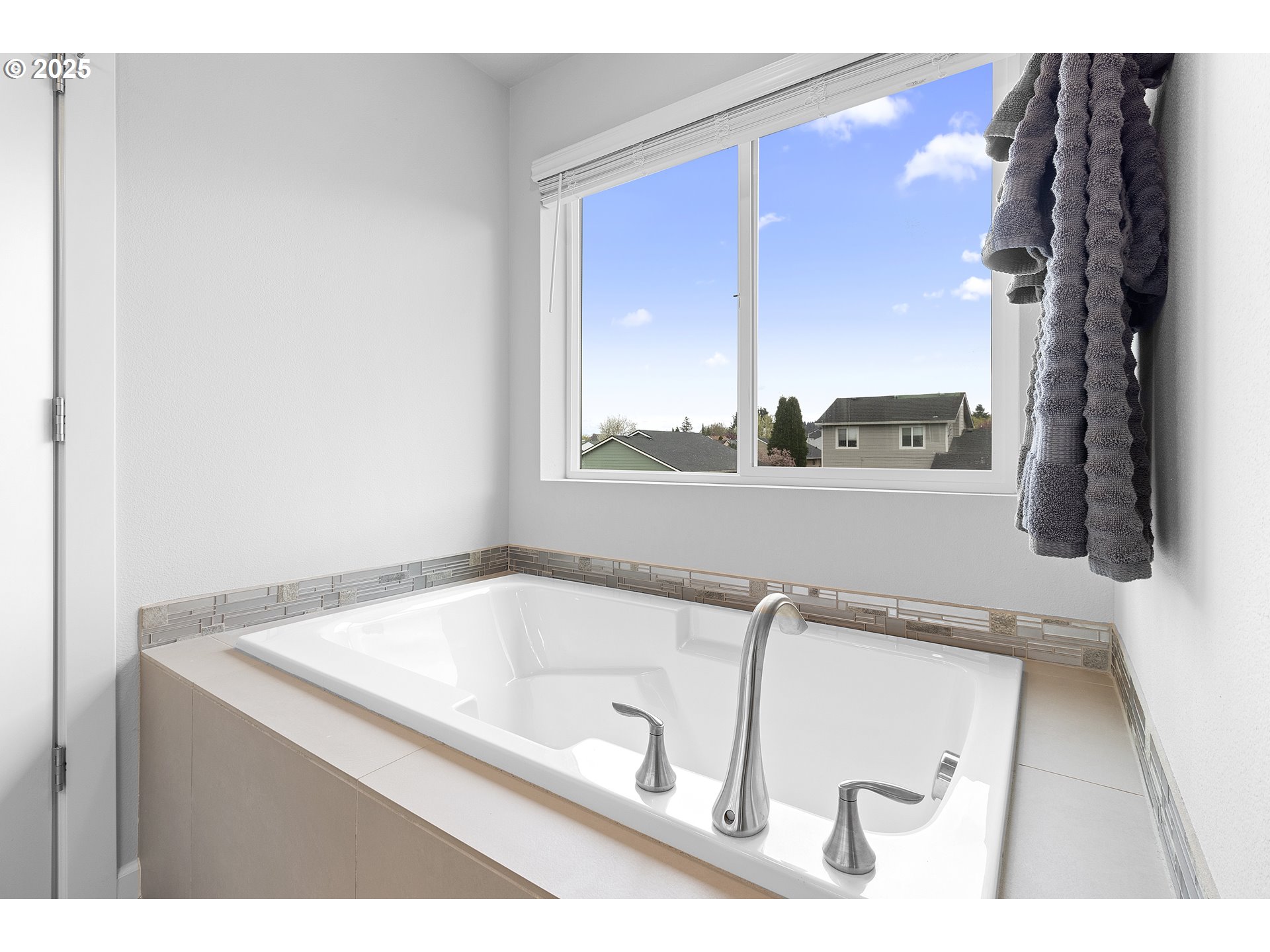 3072 Southeast 25th Street Gresham, OR 97080 - Photo 33 of 48 a bathroom with a tub sink and a window