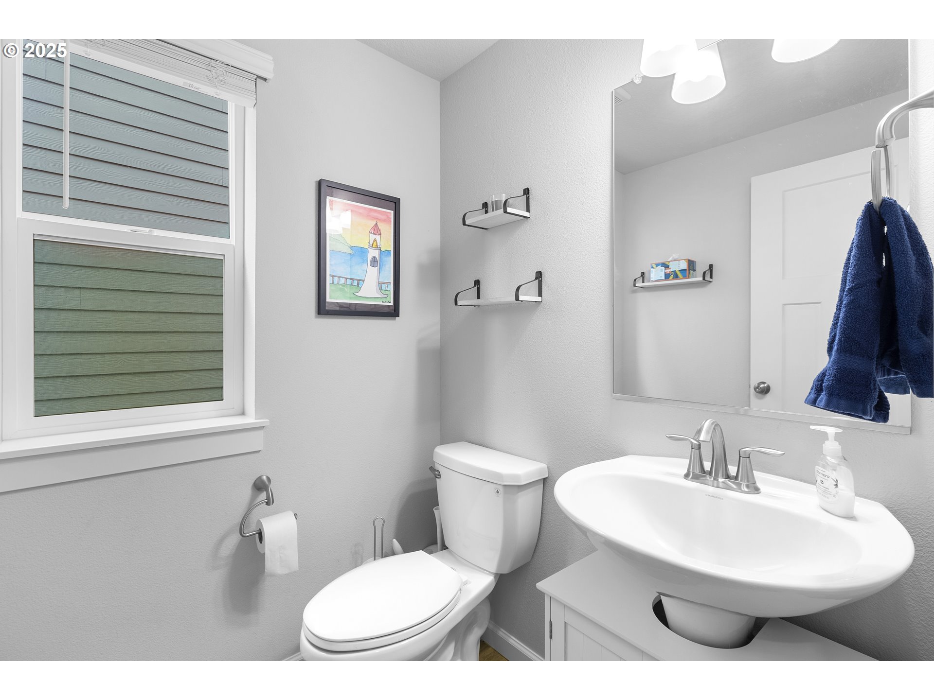 3072 Southeast 25th Street Gresham, OR 97080 - Photo 35 of 48 a bathroom with a toilet a sink and a mirror