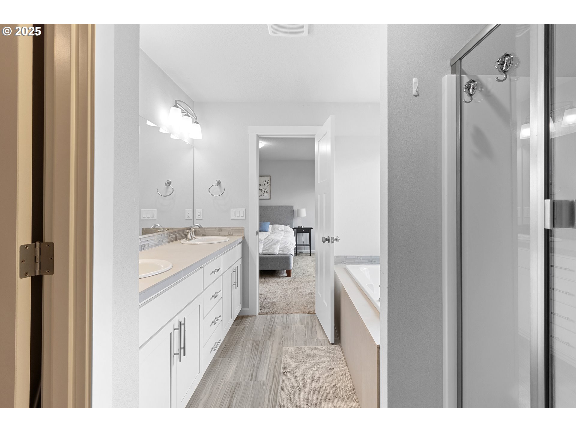 3072 Southeast 25th Street Gresham, OR 97080 - Photo 36 of 48 a spacious bathroom with a granite countertop sink mirror and a bathtub