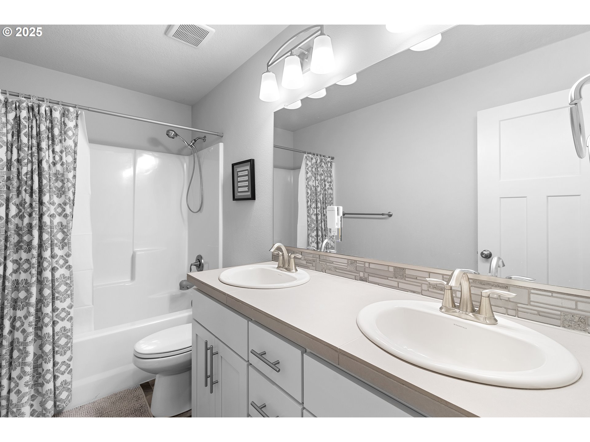 3072 Southeast 25th Street Gresham, OR 97080 - Photo 42 of 48 a bathroom with a sink a toilet and a large mirror