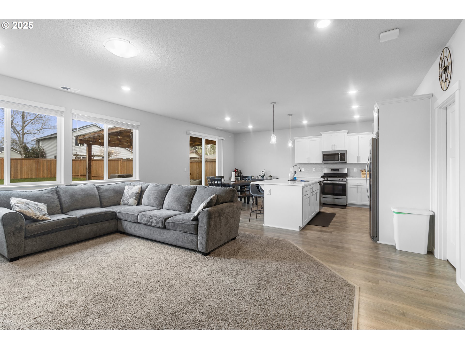 3072 Southeast 25th Street Gresham, OR 97080 - Photo 6 of 48 a living room with furniture and kitchen view with wooden floor