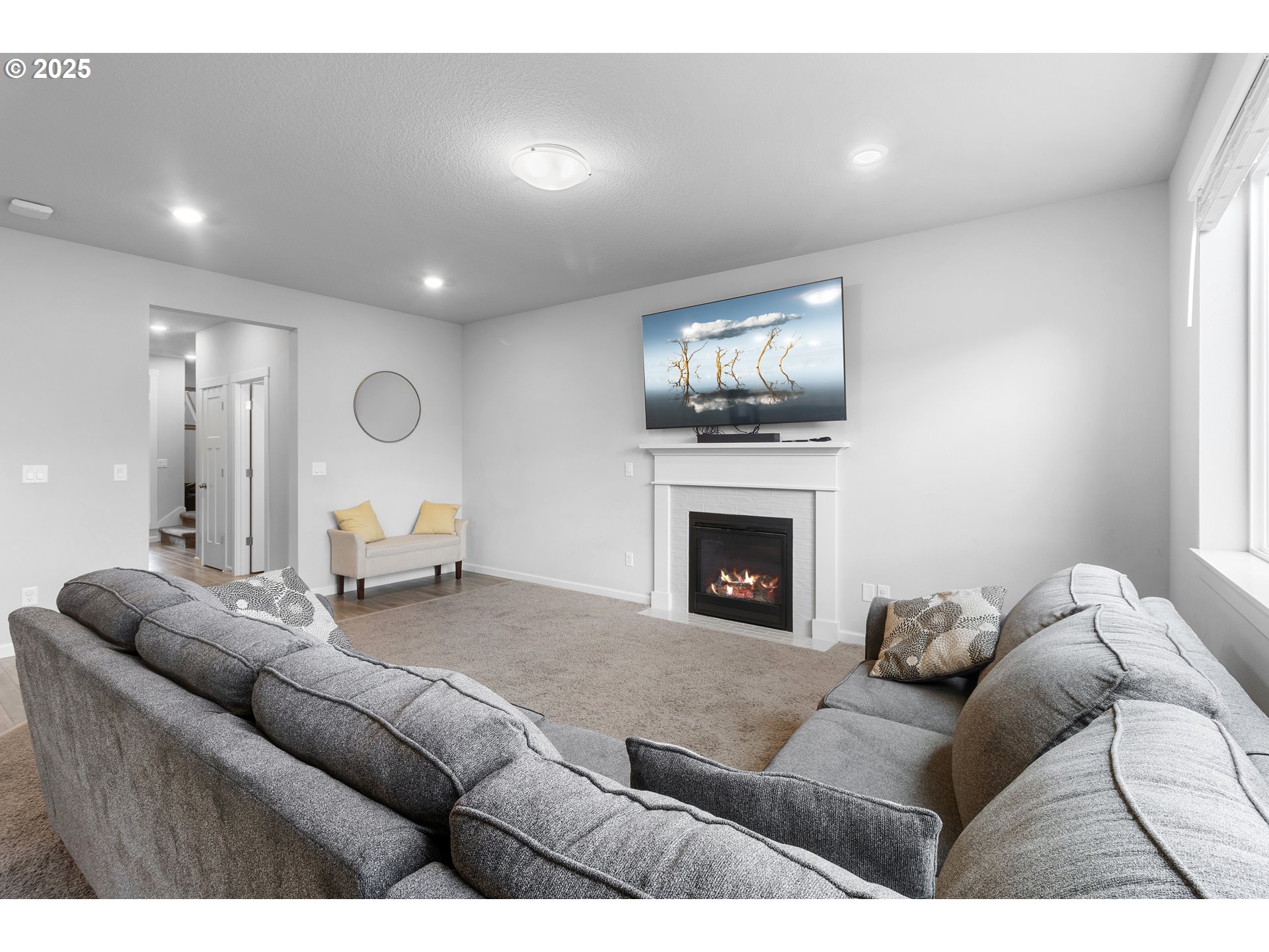 3072 Southeast 25th Street Gresham, OR 97080 - Photo 10 of 48 a living room with furniture a flat screen tv and a fireplace