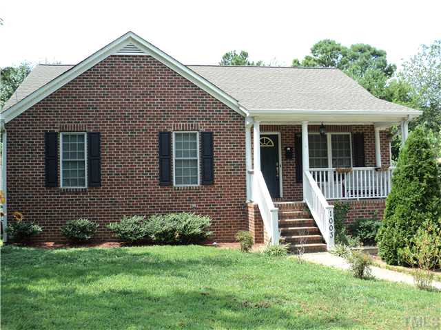 1003 Benjamin Street Raleigh, NC 27604 - Photo 1 of 8 a front view of a house with a yard