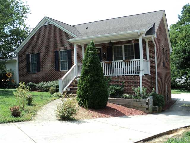 1003 Benjamin Street Raleigh, NC 27604 - Photo 2 of 8 a front view of a house with a yard