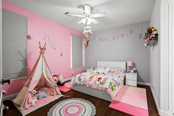 a bedroom with a bed and glass window