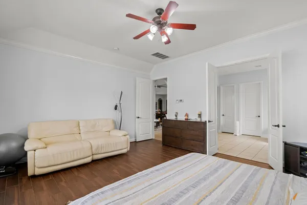 a bathroom with a granite countertop sink a toilet and mirror