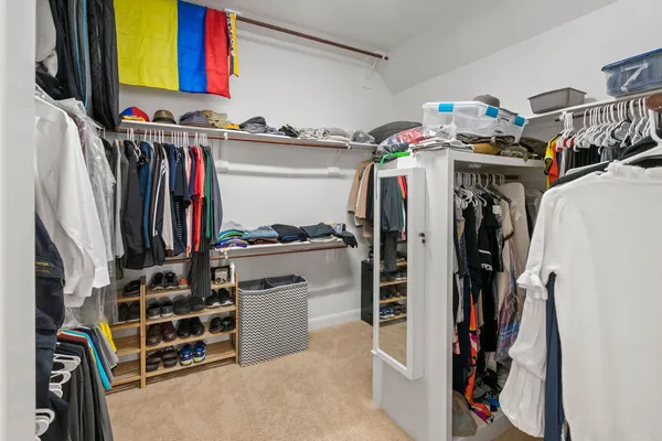 a bathroom with a sink toilet and a mirror