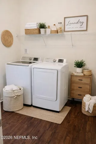 a utility room with cabinets and washer