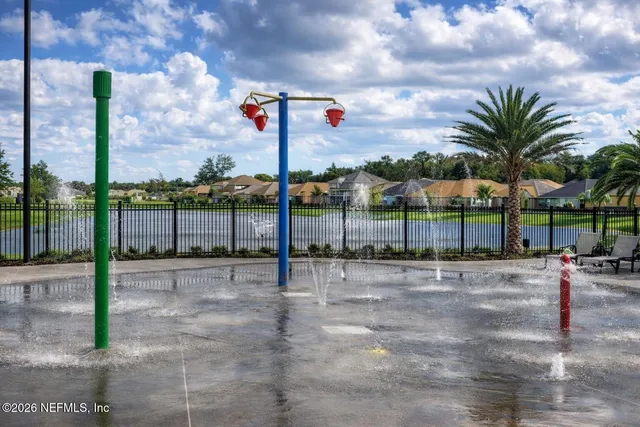 a street sign on a sidewalk next to a road