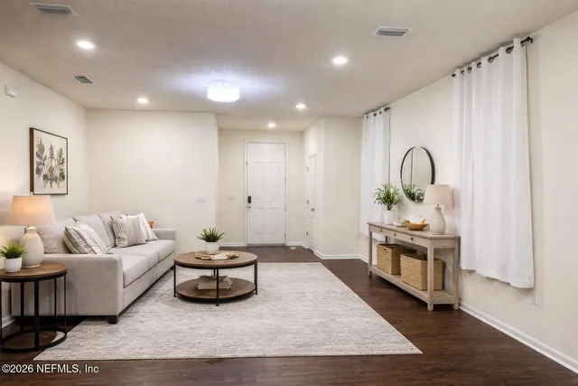 a living room with furniture and a couch