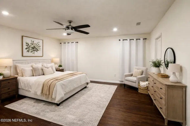 a bedroom with bed and a window