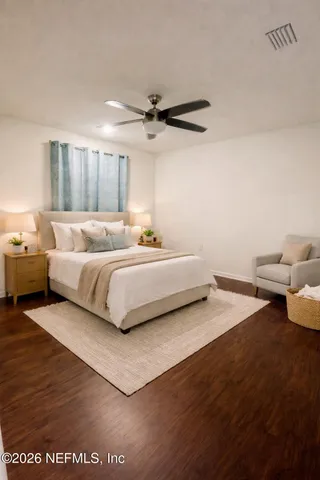 a bedroom with a bed and window