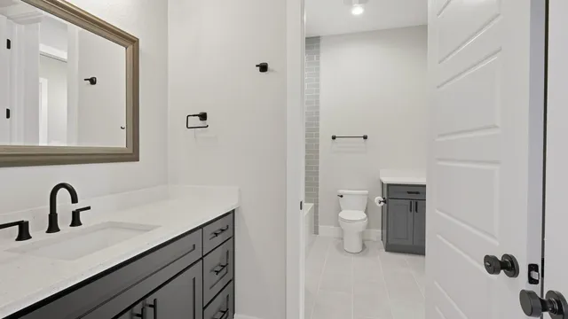 a bathroom with a sink and mirror