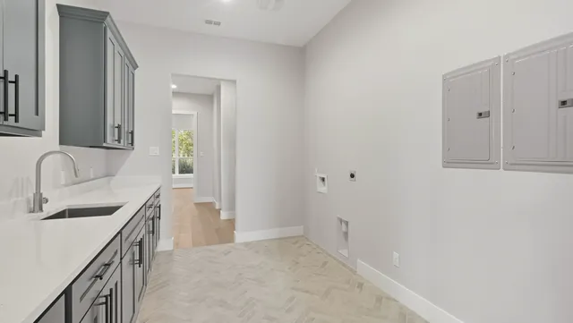 a kitchen with a sink and cabinets