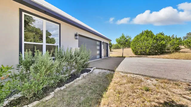 a view of a backyard of the house
