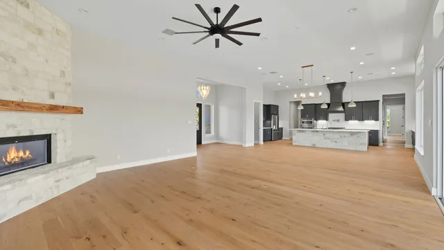 a view of a kitchen with a sink and a fireplace