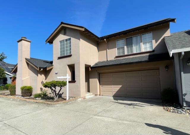 7691 Church Street, Unit B Gilroy, CA 95020 - Photo 1 of 9 a front view of a house with a yard and garage
