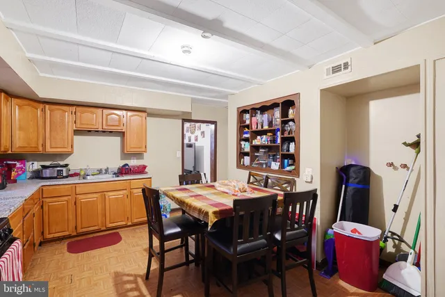 a view of a dining room with furniture and window