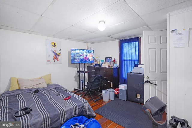 a bedroom with bed and a window