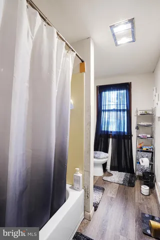 a living room with a couch and a flat tv screen