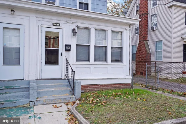 front view of a house with a small yard