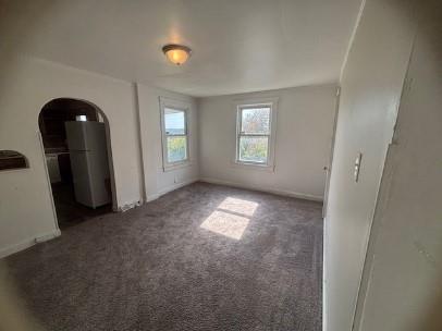 922 Vankirk Street, Unit 1 Clairton, PA 15025 - Photo 4 of 6 an empty room with windows and entrance