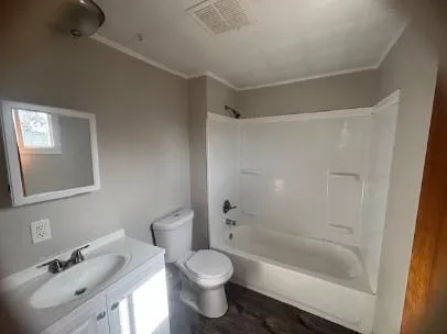 a bathroom with a bathtub shower sink vanity and toilet