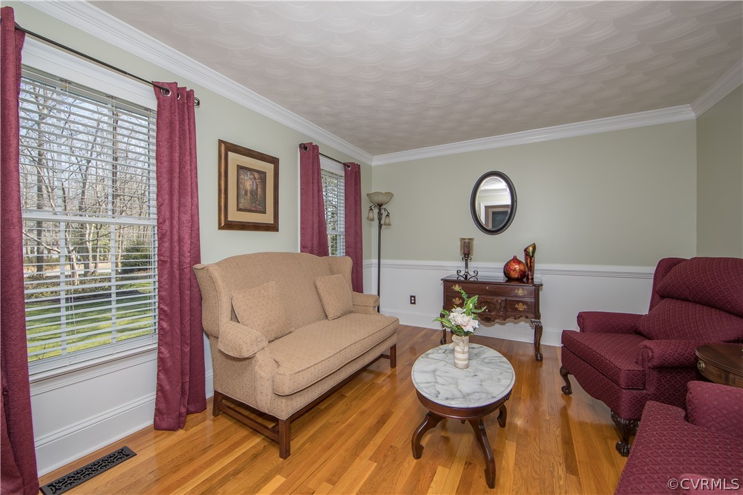 12900 Rivers Bend Road Chester, VA 23836 - Photo 5 of 32 Formal living room. Notice the crown molding and c
