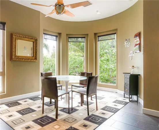 a view of a dining room with furniture and a window