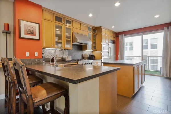 a kitchen with granite countertop a sink and cabinets