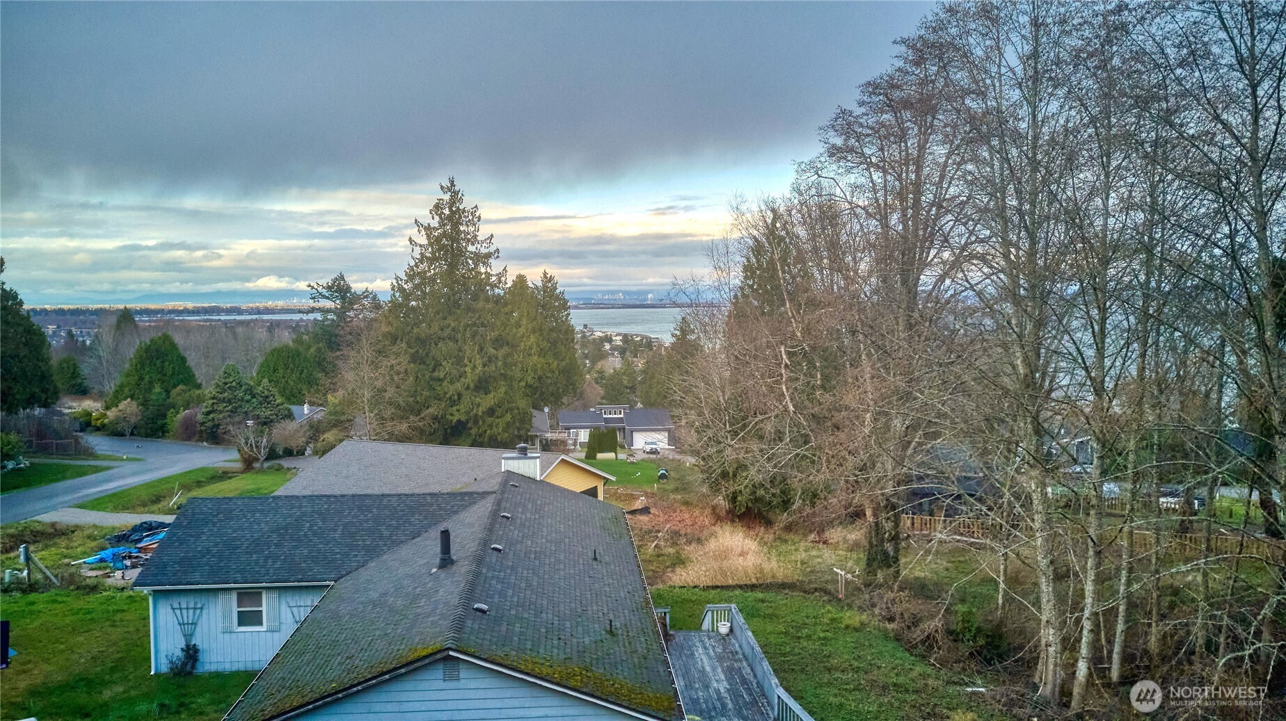 192 Donegal Drive Point Roberts, WA 98281 - Photo 9 of 35 a aerial view of a house with a yard and mountain view in back