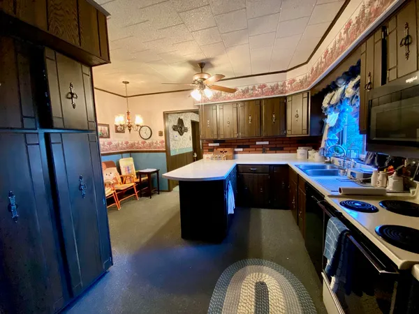 a bedroom with a bed and dresser with mirror