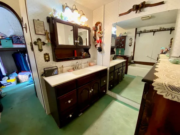 a bathroom with a sink and a mirror