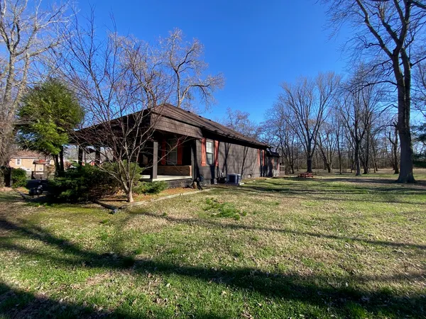 a view of a street with an outdoor seating