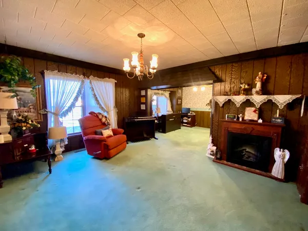 a view of a livingroom with furniture and a window