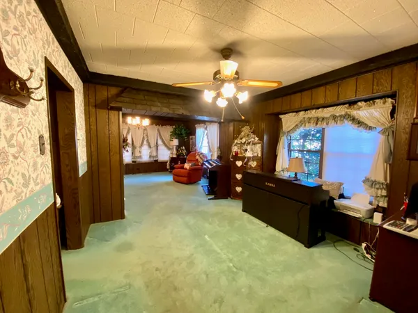 a fireplace with table and chairs