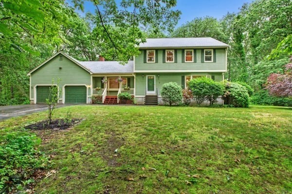 7 Ohio Road Tyngsboro, MA 01879 - Photo 1 of 35 a front view of a house with a garden