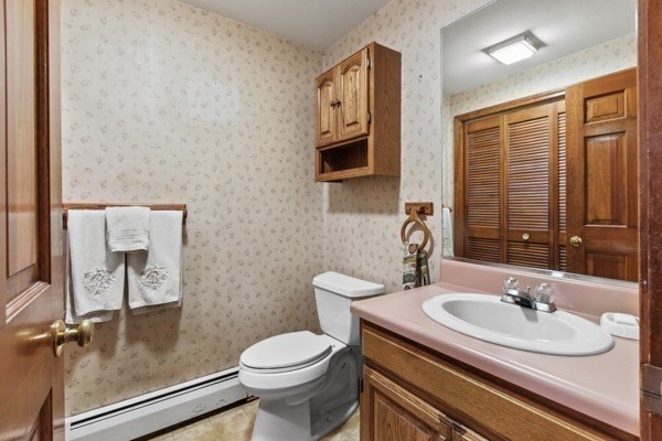 7 Ohio Road Tyngsboro, MA 01879 - Photo 11 of 35 a bathroom with a sink a toilet and mirror