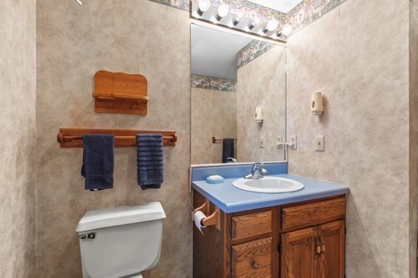 7 Ohio Road Tyngsboro, MA 01879 - Photo 17 of 35 a bathroom with a sink a toilet and mirror