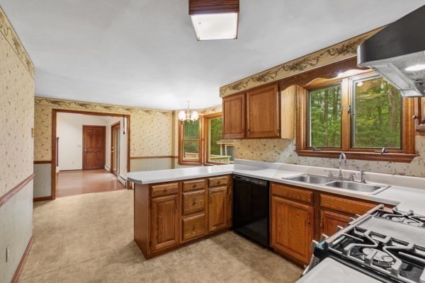 7 Ohio Road Tyngsboro, MA 01879 - Photo 7 of 35 a kitchen with a sink stove and cabinets