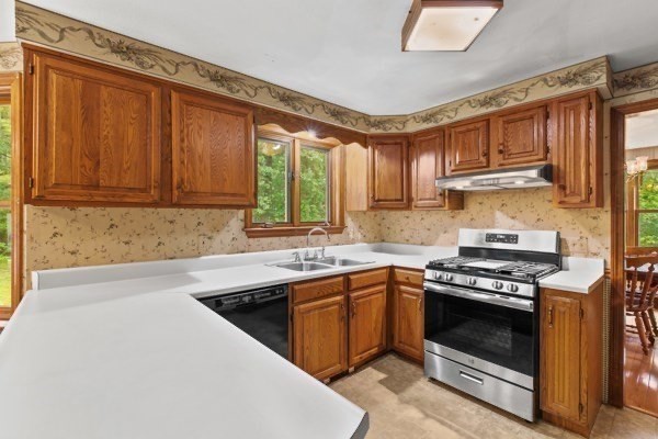 7 Ohio Road Tyngsboro, MA 01879 - Photo 8 of 35 a kitchen with stainless steel appliances granite countertop a stove a sink dishwasher and a microwave oven with cabinets