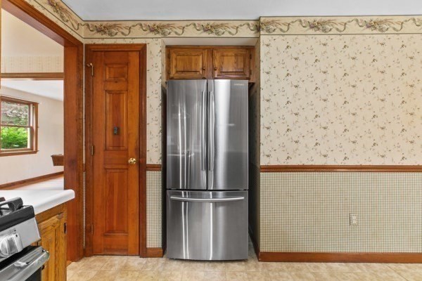 7 Ohio Road Tyngsboro, MA 01879 - Photo 9 of 35 a view of a kitchen with wooden floor and a refrigerator